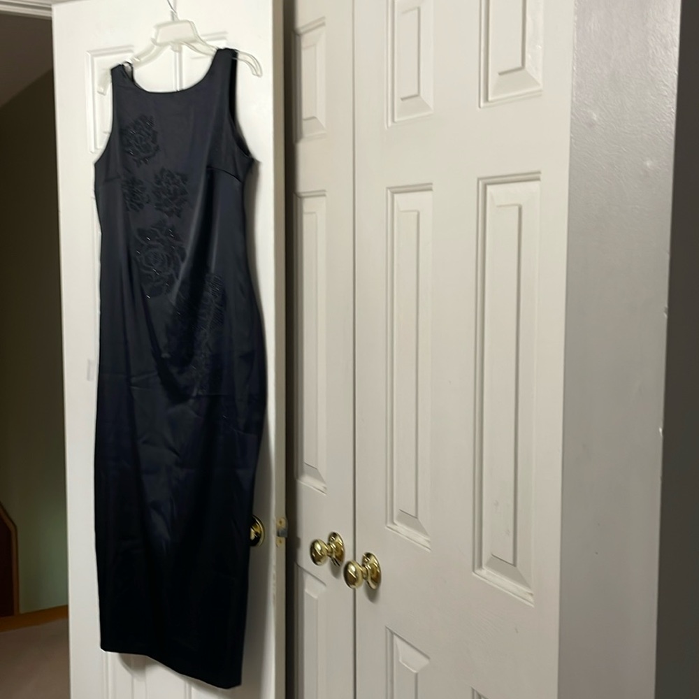 Black sleeveless long dress with beaded embroidery front of dress